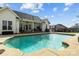 Enjoy this home's refreshing pool with a spacious patio, perfect for relaxation and entertaining at 150 Canopy Oak Ln, Statesville, NC 28625