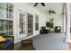 Covered porch featuring white railings, wood furniture, and serene outdoor seating, creating an inviting and relaxing atmosphere at 150 Canopy Oak Ln, Statesville, NC 28625