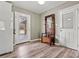 Mudroom featuring a wooden bench with a mirror and coat racks near white doors, creating a functional entryway at 155 33Rd Nw St, Hickory, NC 28601