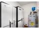 A utility room with storage, water heater, and hardwood floors at 1857 Brownstone St, Charlotte, NC 28216