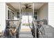 Charming back porch with ceiling fan, seating, and a grill at 2112 Balting Glass Dr, Indian Trail, NC 28079