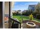 Backyard featuring a fire pit and manicured lawn perfect for outdoor entertaining in a private setting at 2112 Balting Glass Dr, Indian Trail, NC 28079