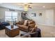 Large carpeted bonus room featuring a ceiling fan, comfortable seating, and natural light at 2112 Balting Glass Dr, Indian Trail, NC 28079
