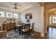 Bright dining room with natural light, modern lighting, and hardwood floors at 2112 Balting Glass Dr, Indian Trail, NC 28079