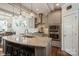A modern kitchen with a granite island, stainless steel appliances, and beautiful pendant lighting at 2112 Balting Glass Dr, Indian Trail, NC 28079