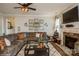 Comfortable living room showcasing hardwood floors, fireplace, and a cozy sectional sofa at 2112 Balting Glass Dr, Indian Trail, NC 28079