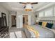 A spacious main bedroom boasts a tray ceiling, natural light, and a view into the ensuite bath and walk-in closet at 2112 Balting Glass Dr, Indian Trail, NC 28079