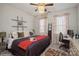 This main bedroom features a ceiling fan, natural light, and a work space at 2112 Balting Glass Dr, Indian Trail, NC 28079