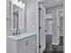 Clean bathroom featuring a modern vanity, updated fixtures, and tile flooring at 2123 Ravendale St, Kannapolis, NC 28083