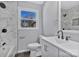 Updated bathroom with marble tile, modern fixtures, and natural light at 2123 Ravendale St, Kannapolis, NC 28083