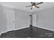 This is a bright bedroom with gray walls, hardwood floors, and paneled doors at 2123 Ravendale St, Kannapolis, NC 28083