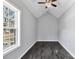Bedroom with vaulted ceiling, large window providing ample natural light, and modern flooring at 2123 Ravendale St, Kannapolis, NC 28083