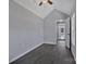 Cozy bedroom features vaulted ceiling, large window, and seamless flooring at 2123 Ravendale St, Kannapolis, NC 28083