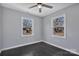 Charming bedroom features hardwood floors, neutral walls, and great natural light from the double windows at 2123 Ravendale St, Kannapolis, NC 28083