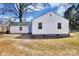 Rear exterior view of the home with a blue back door at 2123 Ravendale St, Kannapolis, NC 28083