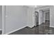 Bright kitchen area features white cabinets, stainless refrigerator and seamless flooring at 2123 Ravendale St, Kannapolis, NC 28083