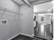 Large laundry room with washer/dryer hookups that leads to the kitchen at 2123 Ravendale St, Kannapolis, NC 28083