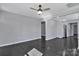 Bright living room with hardwood floors and a modern ceiling fan at 2123 Ravendale St, Kannapolis, NC 28083