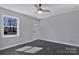 Bright living room featuring hardwood floors, a modern ceiling fan, and a white entry door at 2123 Ravendale St, Kannapolis, NC 28083