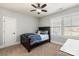 Bedroom with a ceiling fan, large window with blinds, neutral walls, and carpet flooring at 2144 Tatton Hall Rd, Fort Mill, SC 29715