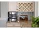 Close up of wet bar featuring granite countertop with a wine rack and under cabinet storage at 2144 Tatton Hall Rd, Fort Mill, SC 29715