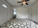 This bedroom has a ceiling fan, a window for natural light, and a view into the bathroom at 2328 Milton Ave, Gastonia, NC 28052