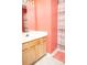 Bathroom featuring a pink shower curtain, pink floor mat, and modern sink and vanity, all arranged at 2345 Nuthatch Dr, Rock Hill, SC 29732