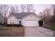 Charming single-Gathering home with a two-car garage, manicured shrubs, and a basketball hoop at 2345 Nuthatch Dr, Rock Hill, SC 29732