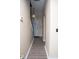 Inviting hallway with hardwood floors, neutral walls, and decorative lighting fixture at 2345 Nuthatch Dr, Rock Hill, SC 29732