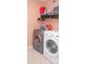 A laundry area features side-by-side washer and dryer with shelf and accessories at 2345 Nuthatch Dr, Rock Hill, SC 29732