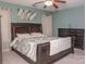 Comfortable main bedroom featuring a ceiling fan, neutral carpet, and abundant natural light from the windows at 2345 Nuthatch Dr, Rock Hill, SC 29732