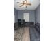 Functional office space with neutral carpet, ceiling fan, and abundant desk and sofa space; ideal for study and work at 2345 Nuthatch Dr, Rock Hill, SC 29732