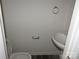A small powder room with a pedestal sink and modern fixtures at 252 Mills Ave, Troutman, NC 28166