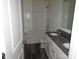 Bathroom with double sink and shower/bath at 252 Mills Ave, Troutman, NC 28166
