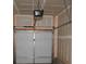 Interior view of the one car garage showing overhead door and mechanicals at 252 Mills Ave, Troutman, NC 28166