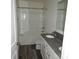 Bathroom with double vanity, granite countertop, and tub-shower combo, offering a practical layout at 260 Mills Ave, Troutman, NC 28166