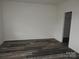 Bedroom with wood-look floors and a closet at 260 Mills Ave, Troutman, NC 28166