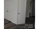 Bedroom with wood-look flooring and large closet with doors, providing ample storage at 260 Mills Ave, Troutman, NC 28166