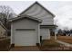 Detached one-car garage with siding that matches the home at 260 Mills Ave, Troutman, NC 28166