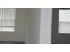 Bright, sun-filled living room with large windows and neutral walls at 260 Mills Ave, Troutman, NC 28166