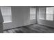 Spacious living room featuring abundant natural light and stylish wood flooring at 260 Mills Ave, Troutman, NC 28166