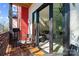 Cozy balcony with outdoor seating and grilling area, offering access to the interior living space through sliding doors at 2710 N Davidson St, Charlotte, NC 28205