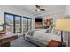 Comfortable bedroom featuring large windows, modern decor, and an abundance of natural light at 2710 N Davidson St, Charlotte, NC 28205