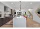 Bright, open kitchen features a large island, modern appliances, and seamless flow into the living area at 2710 N Davidson St, Charlotte, NC 28205