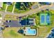 Overhead shot of community amenities: swimming pool, tennis courts, and clubhouse at 27467 Cinderella Cir, Lancaster, SC 29720