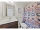 Bathroom featuring a patterned shower curtain, neutral paint, and modern faucet at 27467 Cinderella Cir, Lancaster, SC 29720