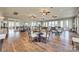 Clubhouse dining area features multiple tables and chairs, perfect for gatherings at 27467 Cinderella Cir, Lancaster, SC 29720