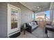Relaxing covered porch with outdoor seating and a ceiling fan at 27467 Cinderella Cir, Lancaster, SC 29720