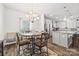 Inviting dining area adjacent to a modern kitchen, perfect for entertaining guests at 27467 Cinderella Cir, Lancaster, SC 29720