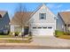 Charming home featuring a two-car garage, covered entry and manicured landscaping at 27467 Cinderella Cir, Lancaster, SC 29720